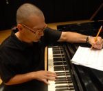 Earl MacDonald, composing and arranging music.