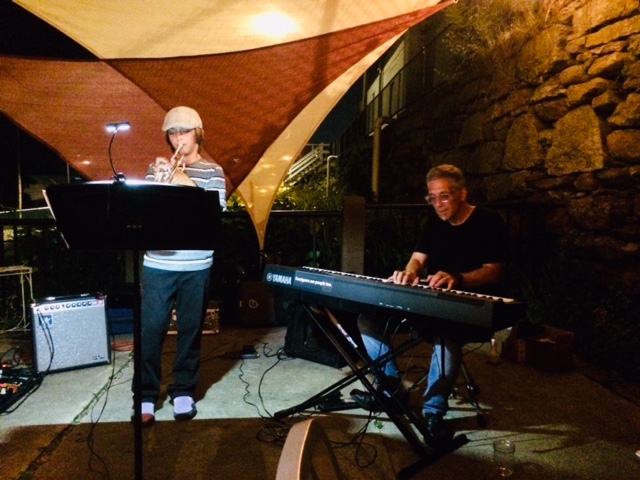 Logan, put his trumpet practice routine to work by performing at Cafemantic with his dad accompanying on piano.