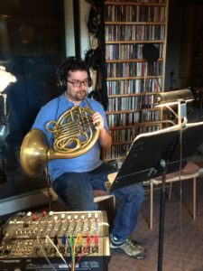 Alex Gertner overdubbing French horn parts for the Earl MacDonald recording project, "Consecrated."