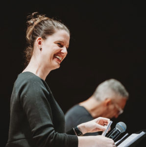 Vocalist Karly Epp, smiling and enjoying a fun moment during a rehearsal with pianist, Earl MacDonald.